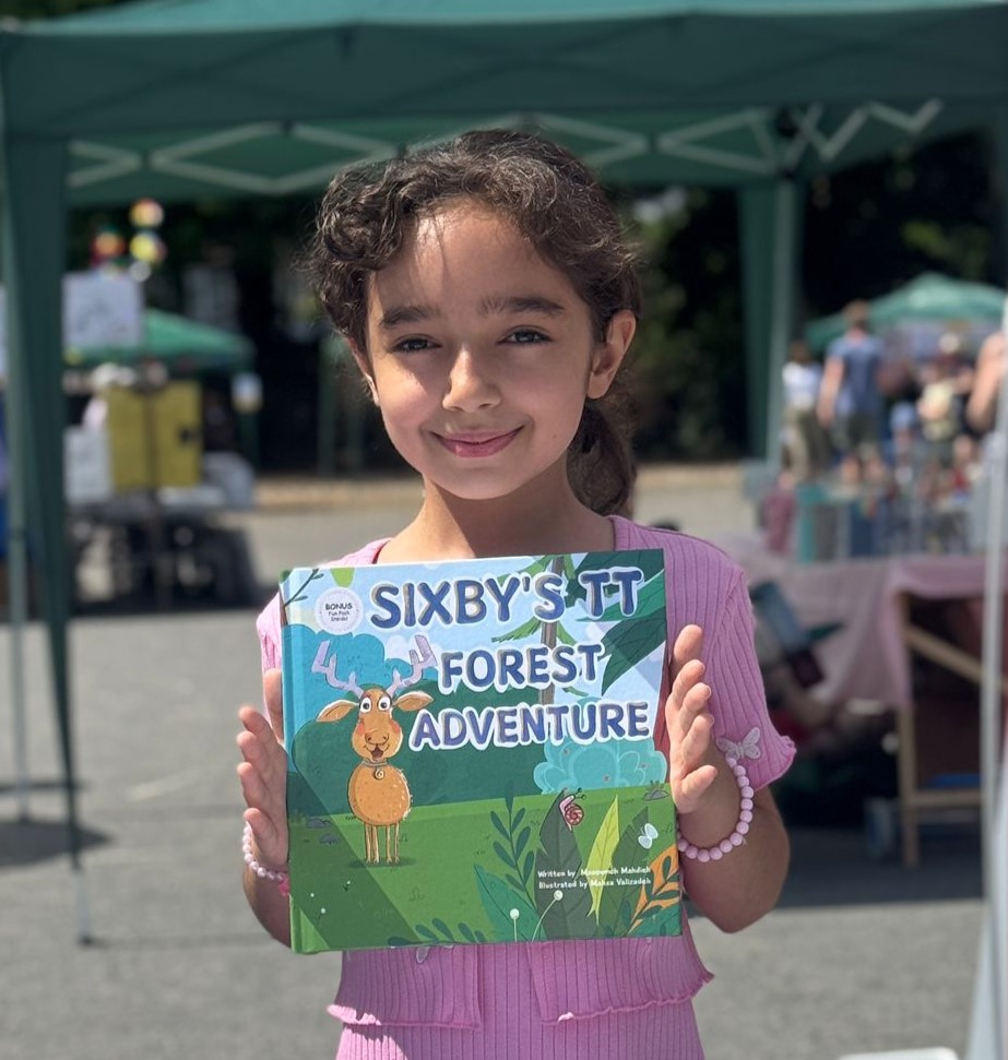 Child buying Sixby’s storybook, smiling with excitement